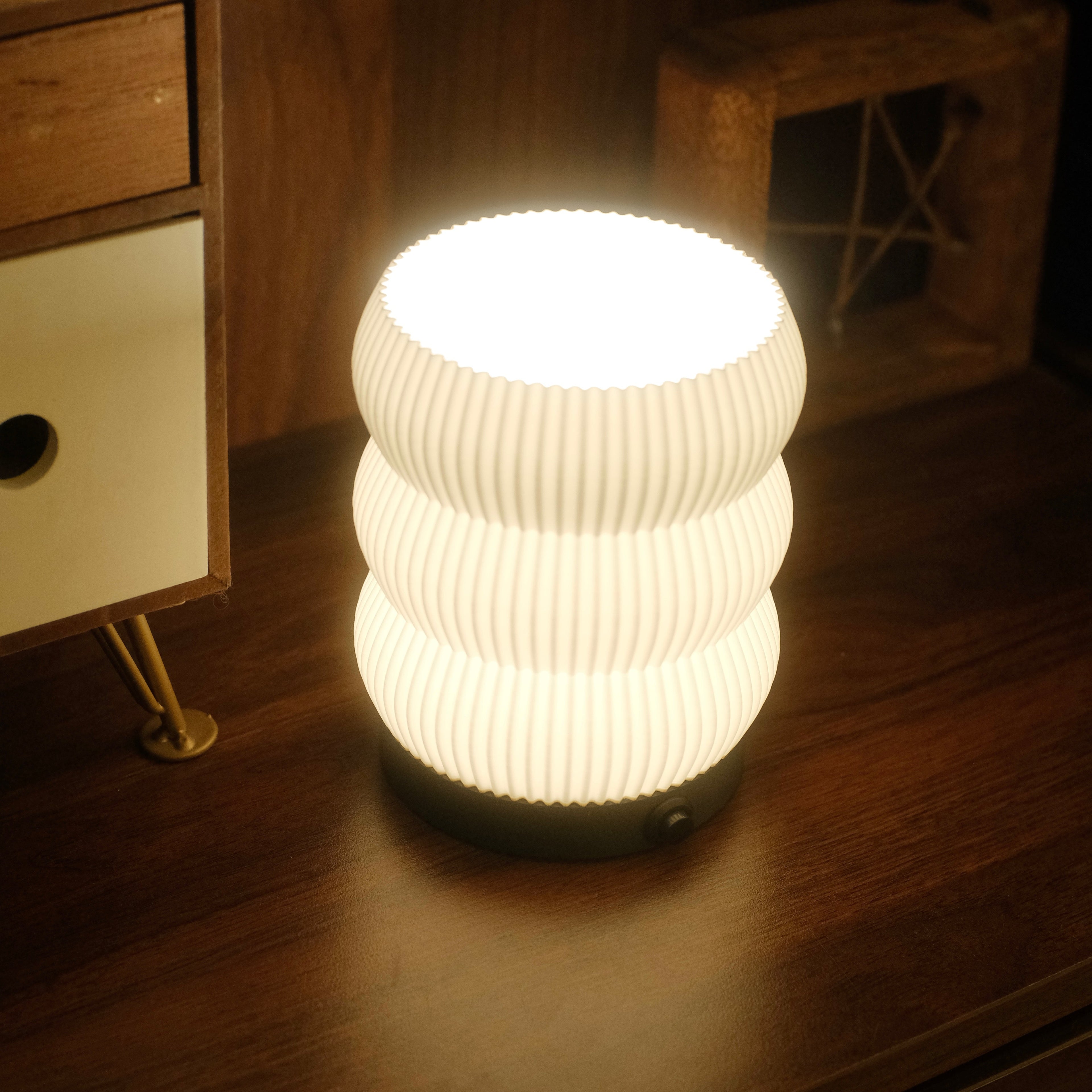 Lighted lamp on a wooden surface with a blurred background